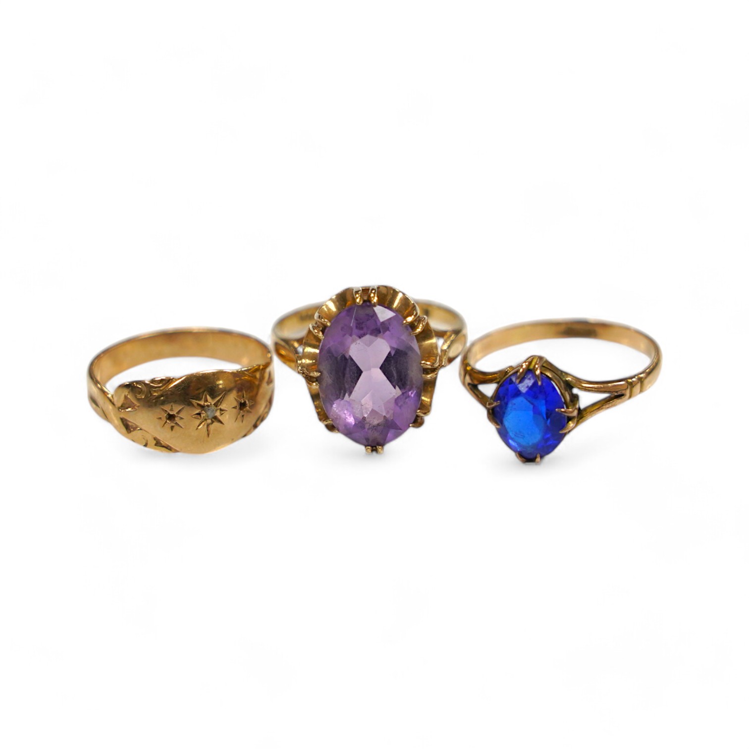 A modern 9ct gold and amethyst set dress ring, a 9ct and diamond chip set ring and a yellow metal (stamped 15c) and blue stone set ring, gross weight 8.2 grams. Condition - poor to fair